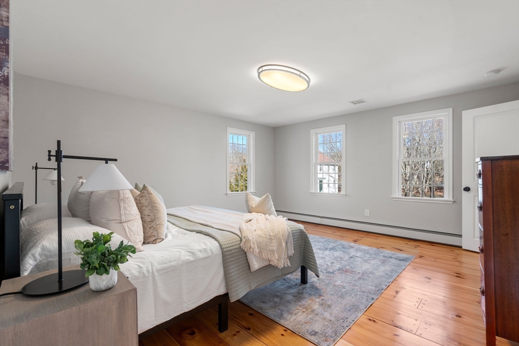 25 Charles Street Hingham, MA 02043 - Photo 17 of 32 a bedroom with a bed and a window