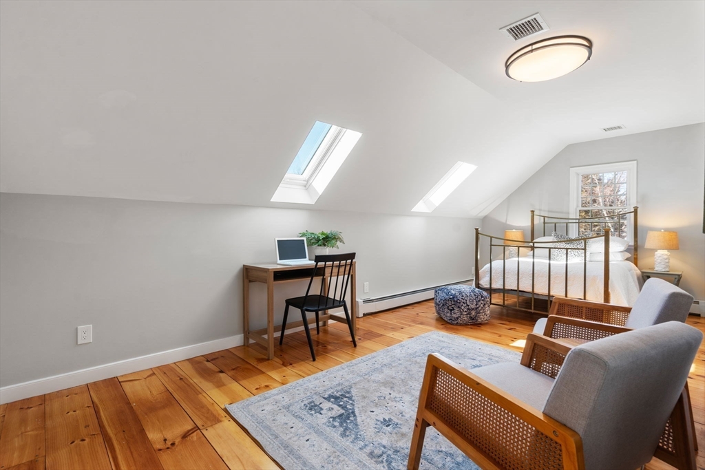 25 Charles Street Hingham, MA 02043 - Photo 20 of 32 a living room with furniture and a wooden floor