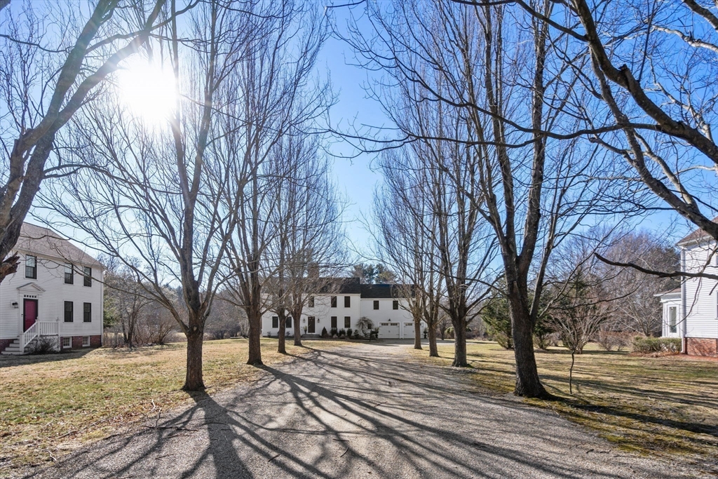 25 Charles Street Hingham, MA 02043 - Photo 24 of 32 a view of a yard with a house