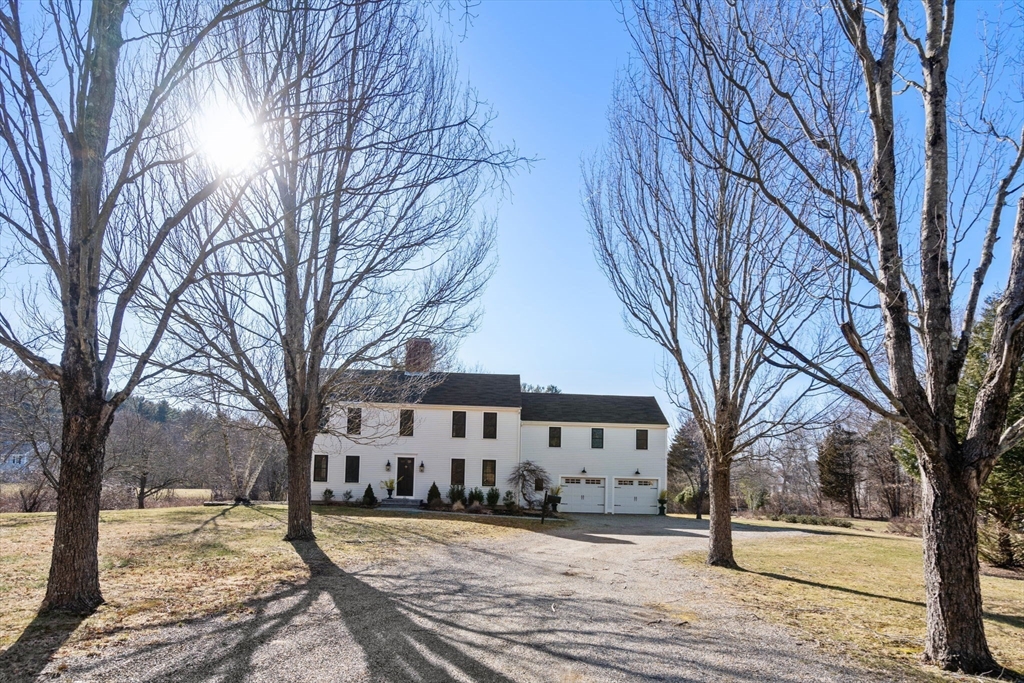 25 Charles Street Hingham, MA 02043 - Photo 31 of 32 a view of a house with a snow in the yard