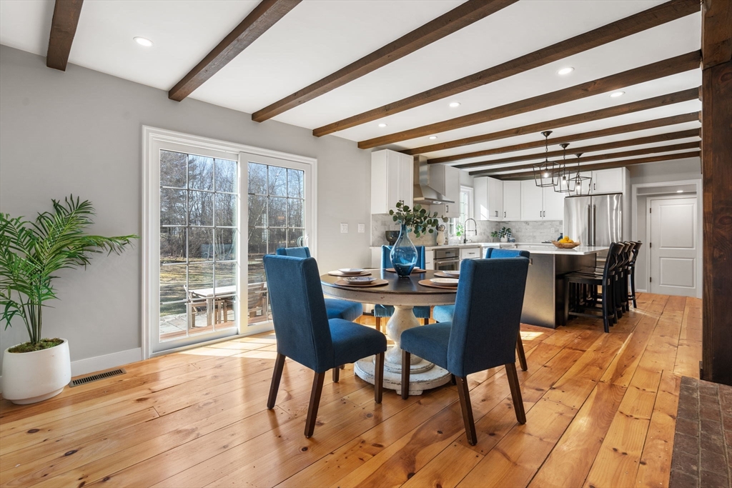 25 Charles Street Hingham, MA 02043 - Photo 4 of 32 a dining room with furniture and wooden floor