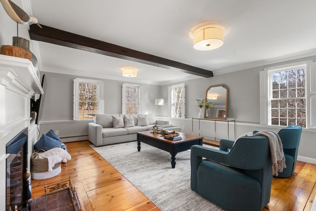 25 Charles Street Hingham, MA 02043 - Photo 7 of 32 a living room with furniture and a large window