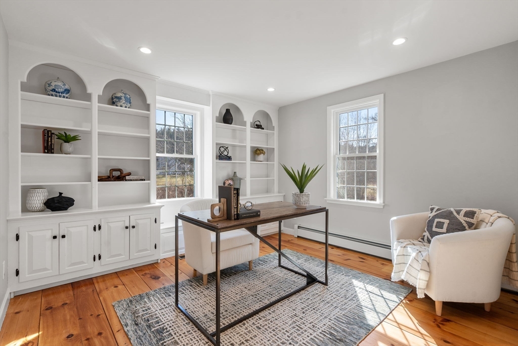 25 Charles Street Hingham, MA 02043 - Photo 9 of 32 a living room with furniture and decor
