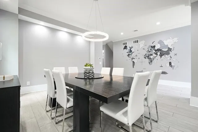 a bathroom with a toilet a sink a mirror and vanity