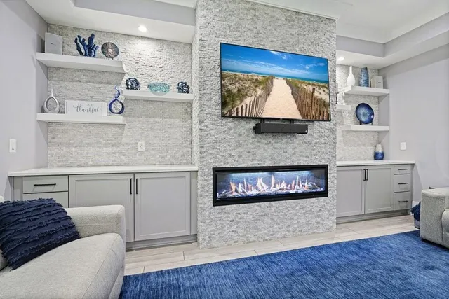 a spacious bedroom with a bed and a large window