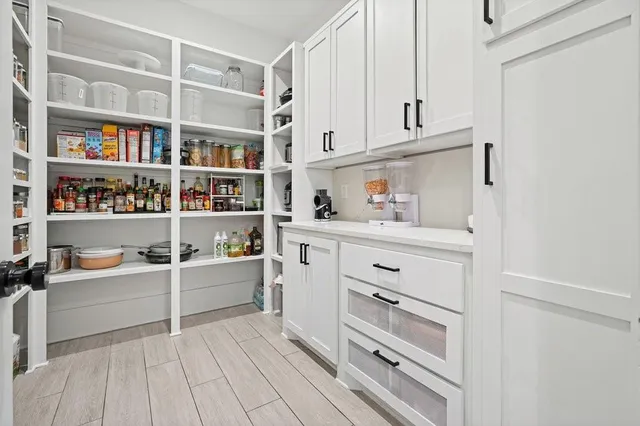 a bedroom with a large bed and a large window