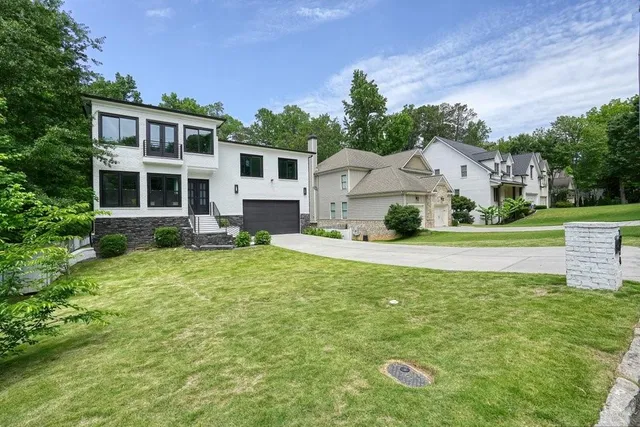 a front view of a house with garden