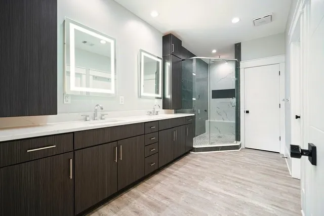 a bathroom with a shower and toilet