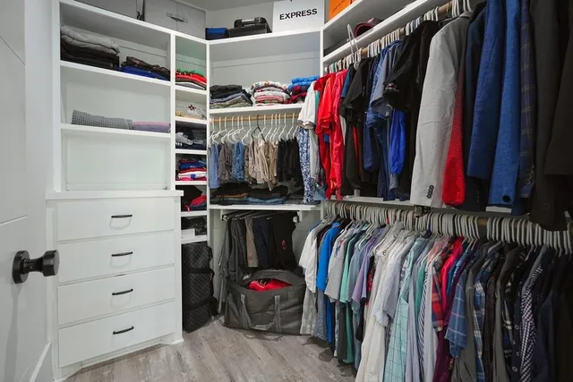 a front view of a house with a garden and yard