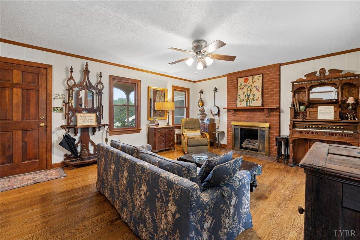 3289 Peaks Road Bedford, VA 24523 - Photo 11 of 71 a living room with furniture a fireplace and a flat screen tv