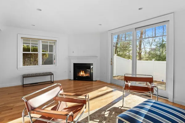 a living room with a couch a dining table and a fireplace