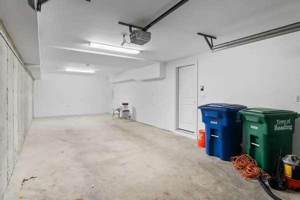 a view of a storage & utility room with two washing machine