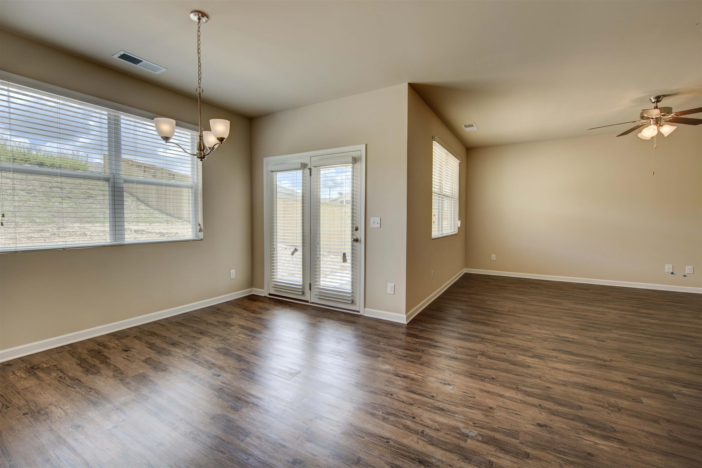 Dining room/living room - Photos are of same floor plan - Construction on lot 63 has not started.