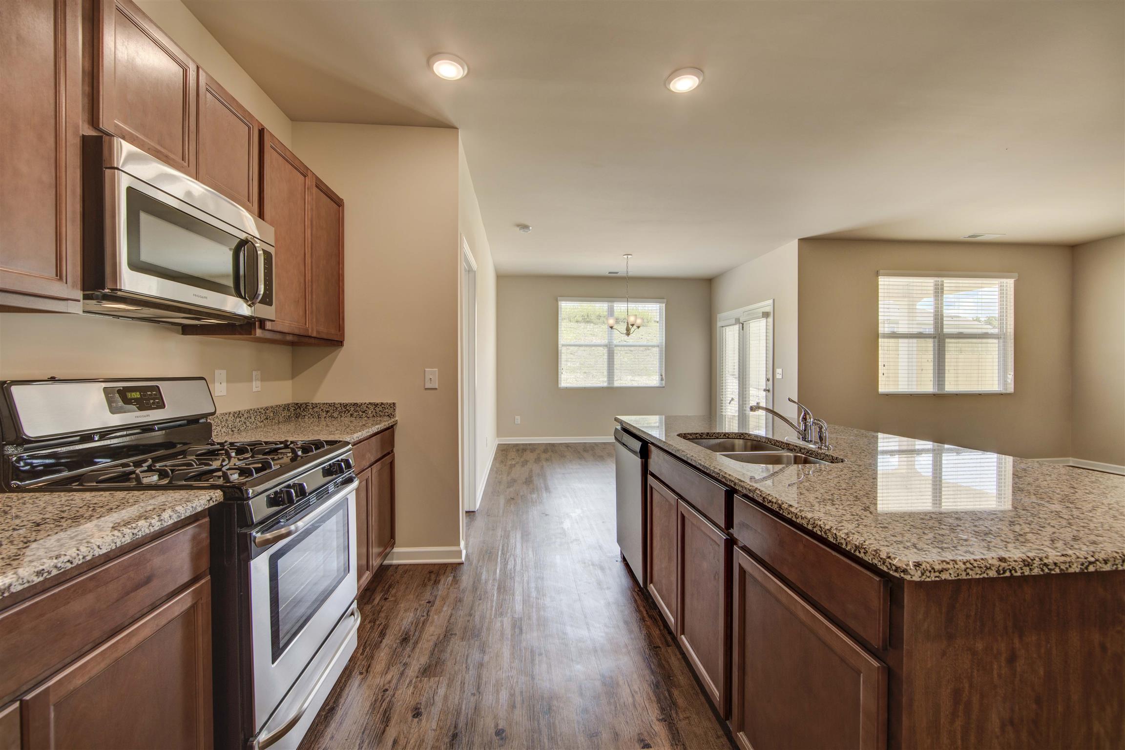 Kitchen - Photos are of same floor plan - Construction on lot 63 has not started.
