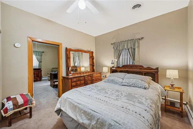 a bedroom with a bed and furniture