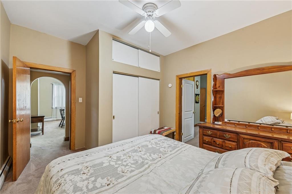 310 Bungalow Road New Alexandria, PA 15670 - Photo 16 of 30 a bedroom with a bed and a chandelier