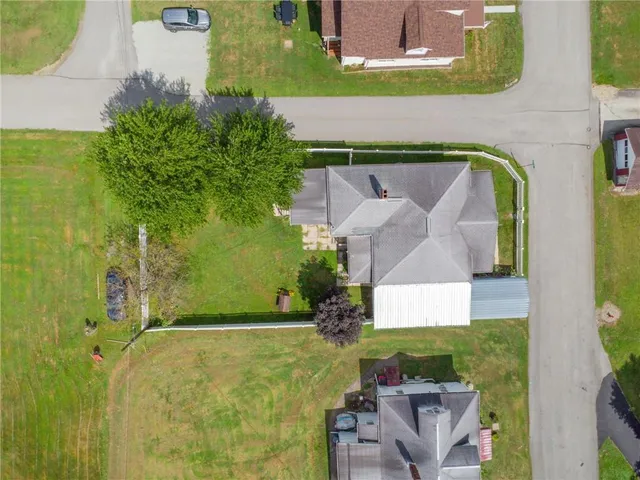 a front view of a house with a garden and deck