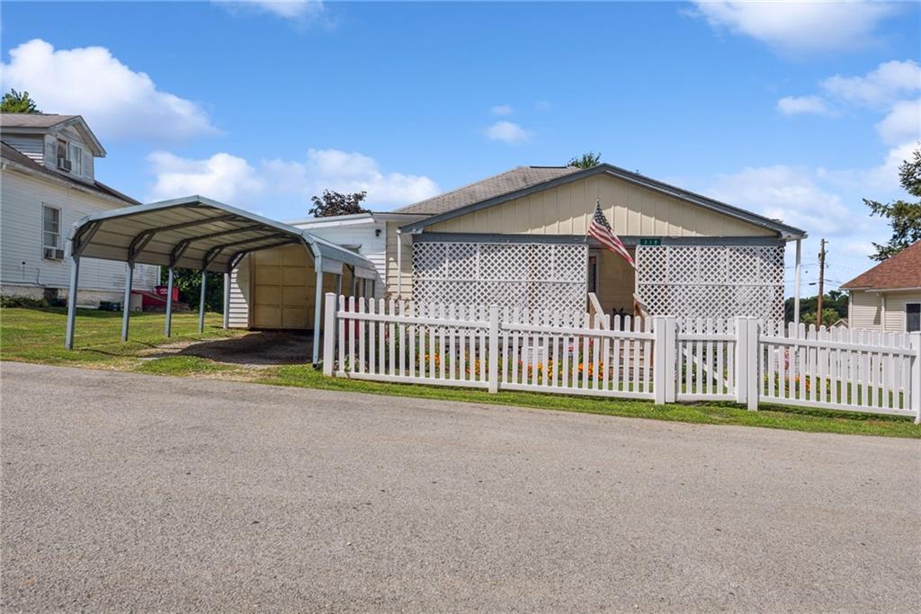 310 Bungalow Road New Alexandria, PA 15670 - Photo 30 of 30 a front view of a house with a garden and deck