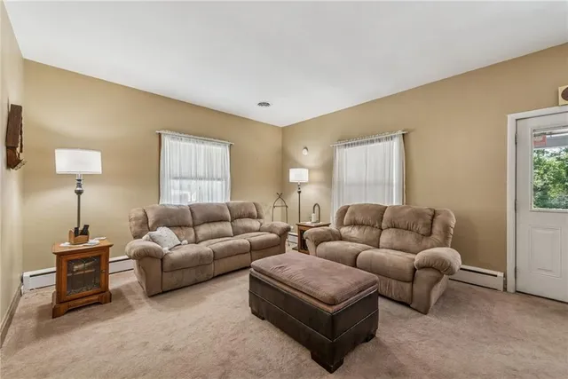 a living room with furniture and a window