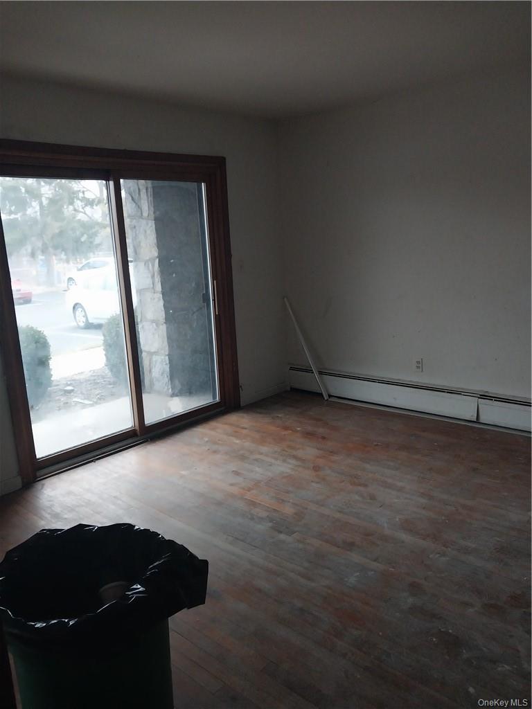 250 North Main Street, Unit F5 Spring Valley, NY 10977 - Photo 8 of 10 a view of room with window and hardwood floor