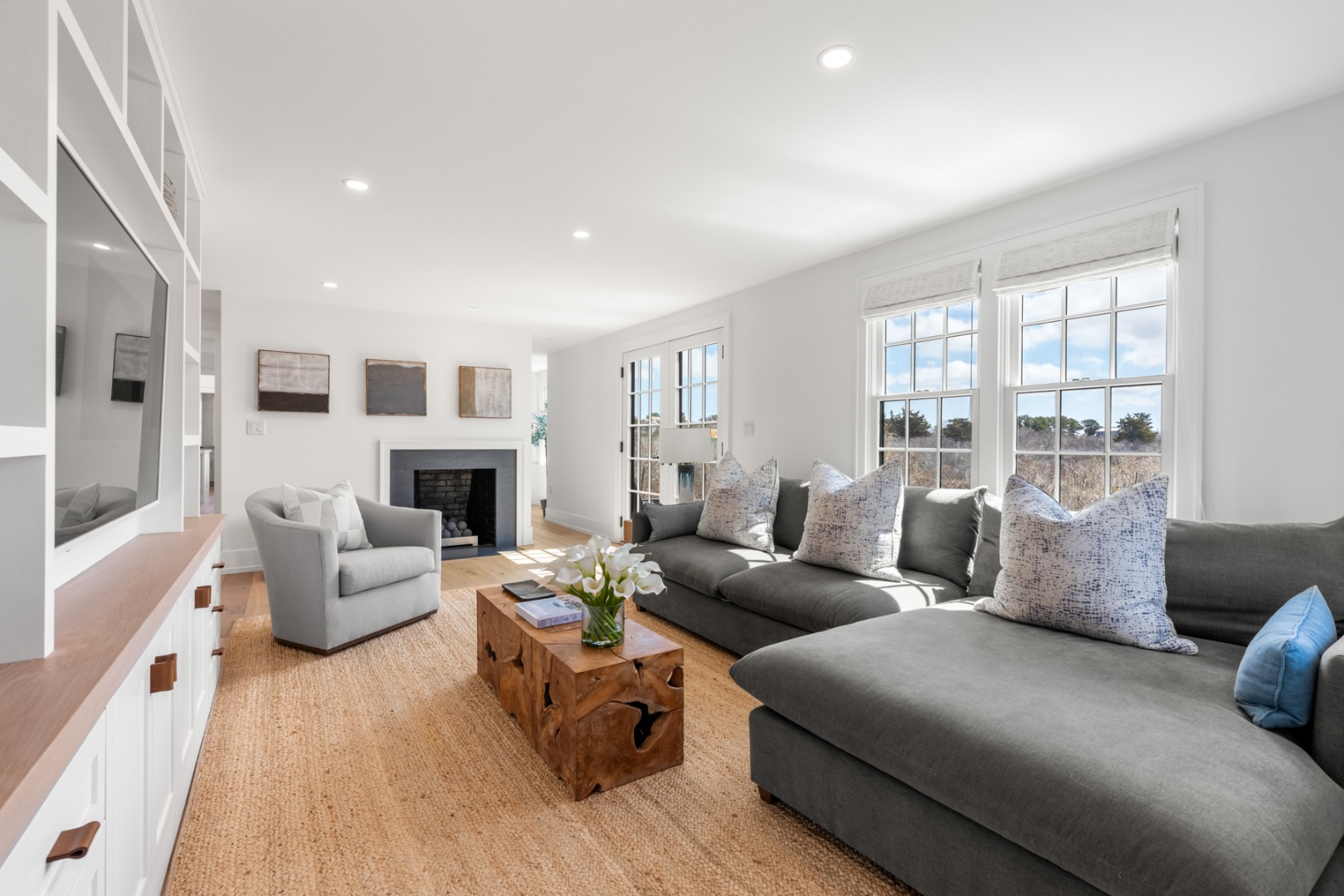 174 Cliff Road Nantucket, MA 02554 - Photo 7 of 49 a living room with furniture fireplace and a large window