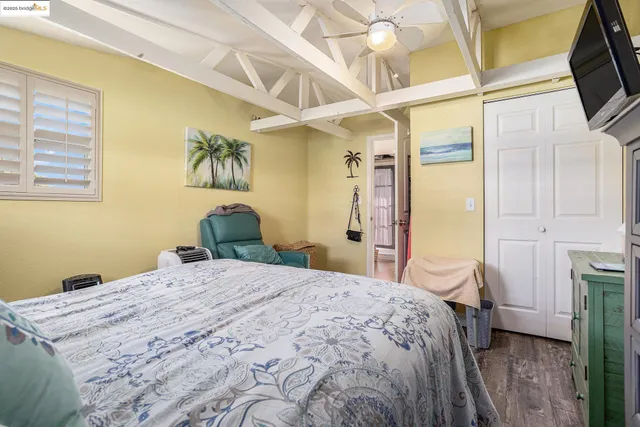a view of a livingroom with furniture and hardwood floor