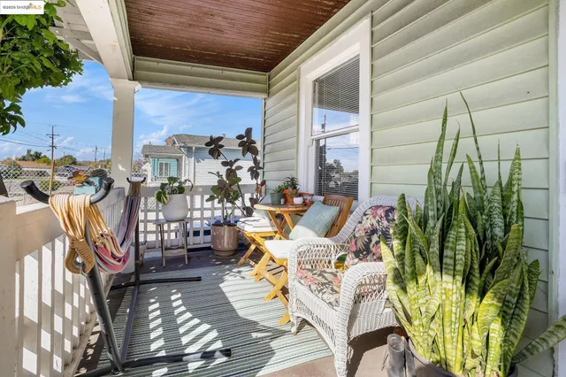 a view of balcony with furniture