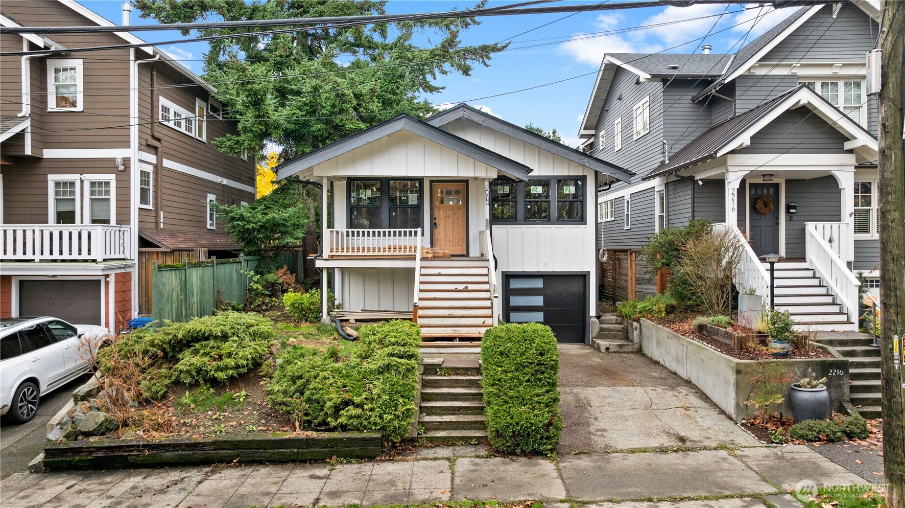 2212 North 46th Street Seattle, WA 98103 - Photo 2 of 25 a front view of a house with garden