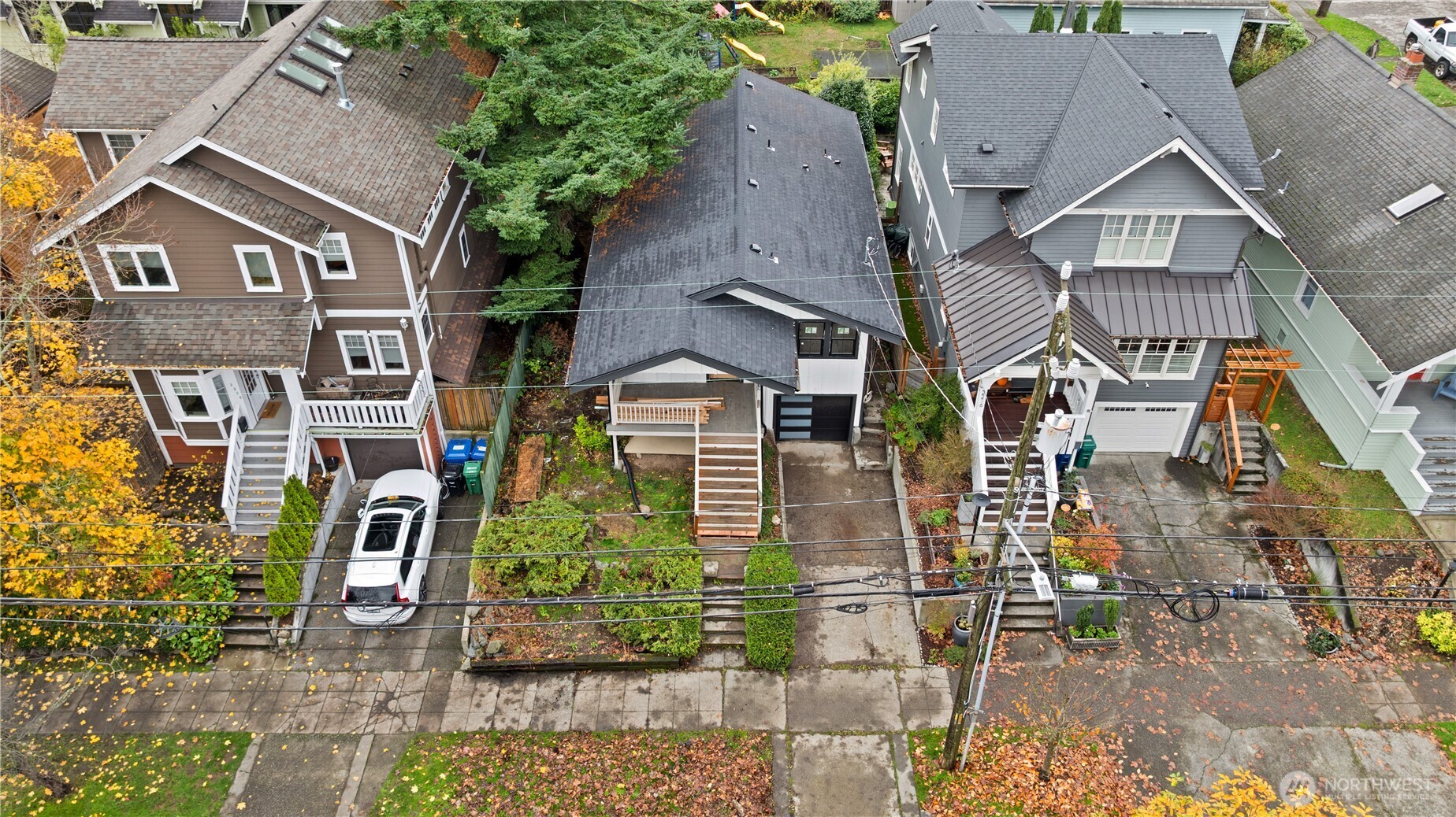 2212 North 46th Street Seattle, WA 98103 - Photo 25 of 25 an aerial view of a residential apartment building with a yard