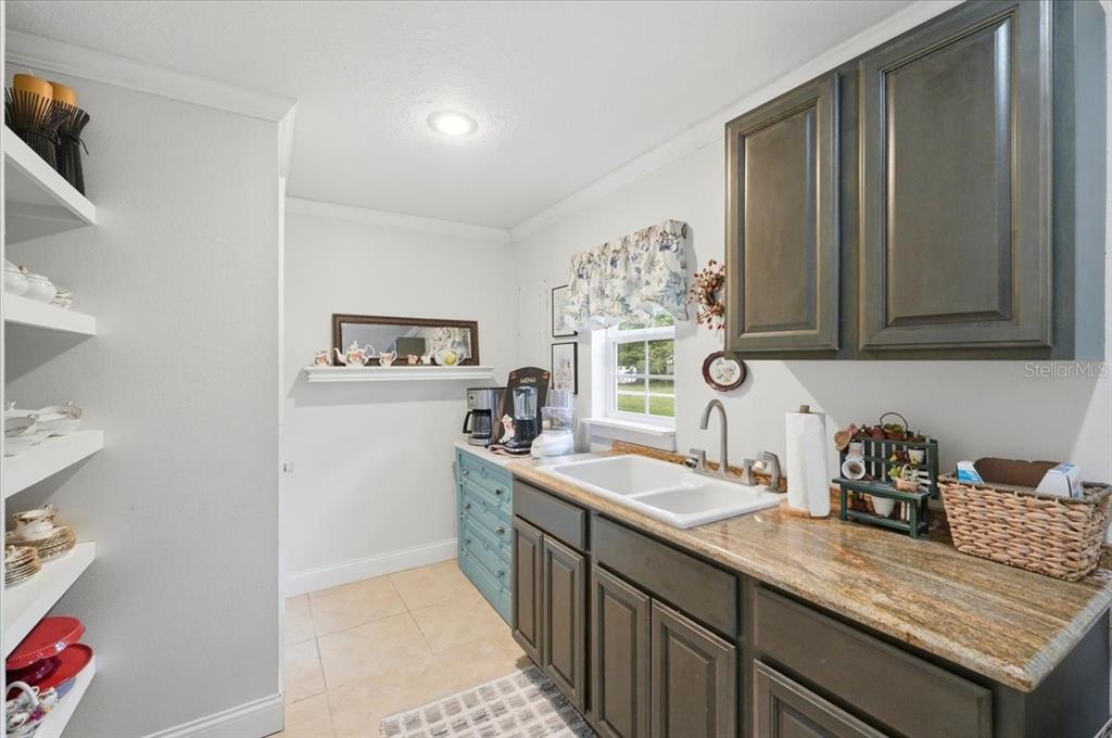 2910 Fritzke Road Dover, FL 33527 - Photo 72 of 100 a kitchen with sink cabinets and stove