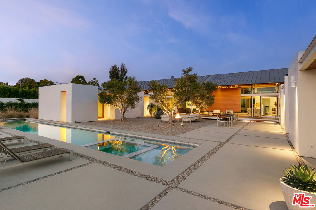 6728 Wildlife Road Malibu, CA 90265 - Photo 42 of 57 a view of a swimming pool with a patio