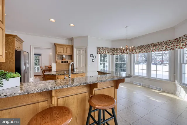 a kitchen with a stove and cabinets