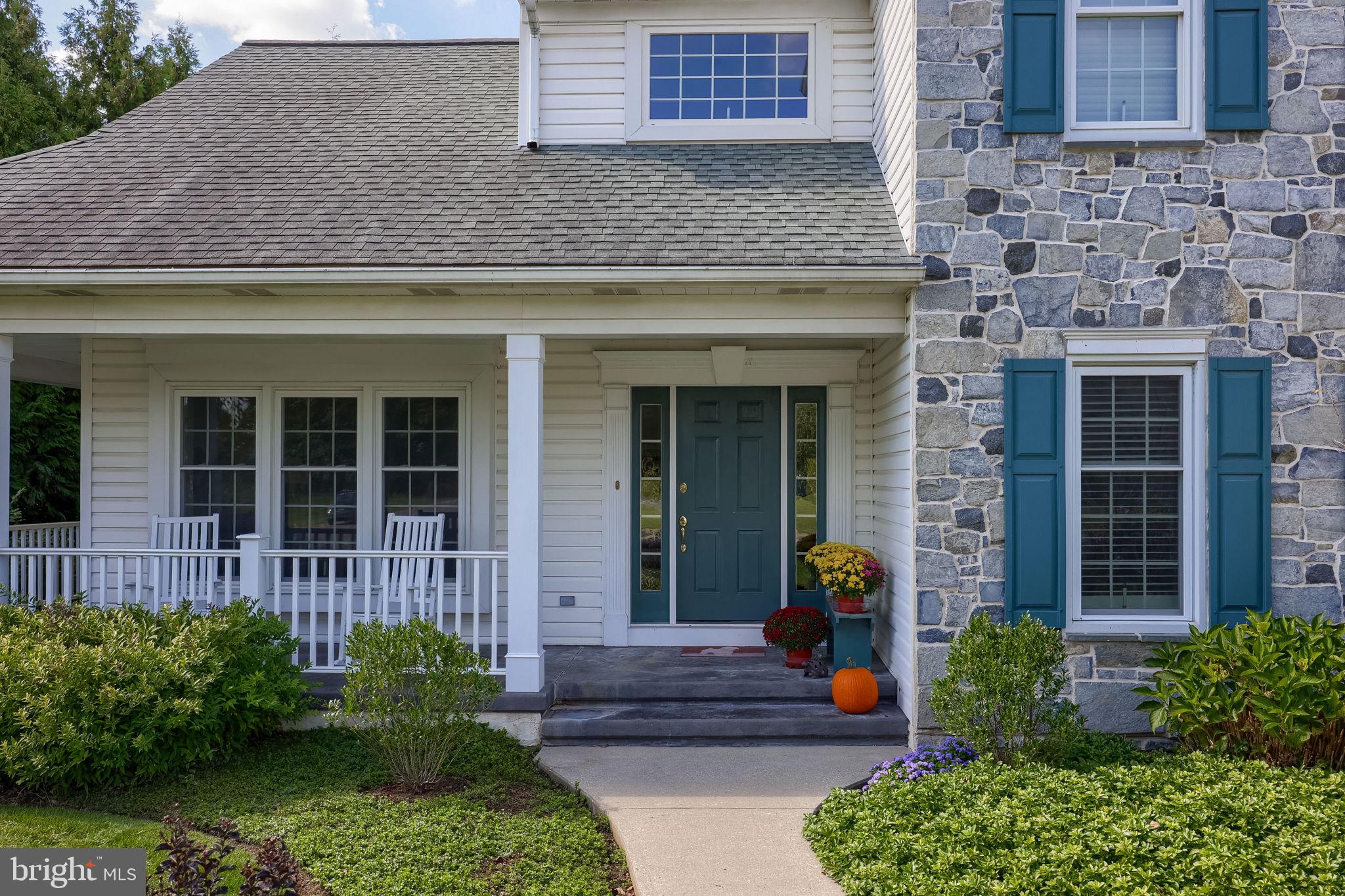 168 Olde Field Drive Lititz, PA 17543 - Photo 2 of 74 a view of a house with potted plants and a bench