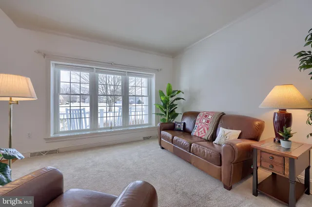 a bedroom with a bed and a potted plant