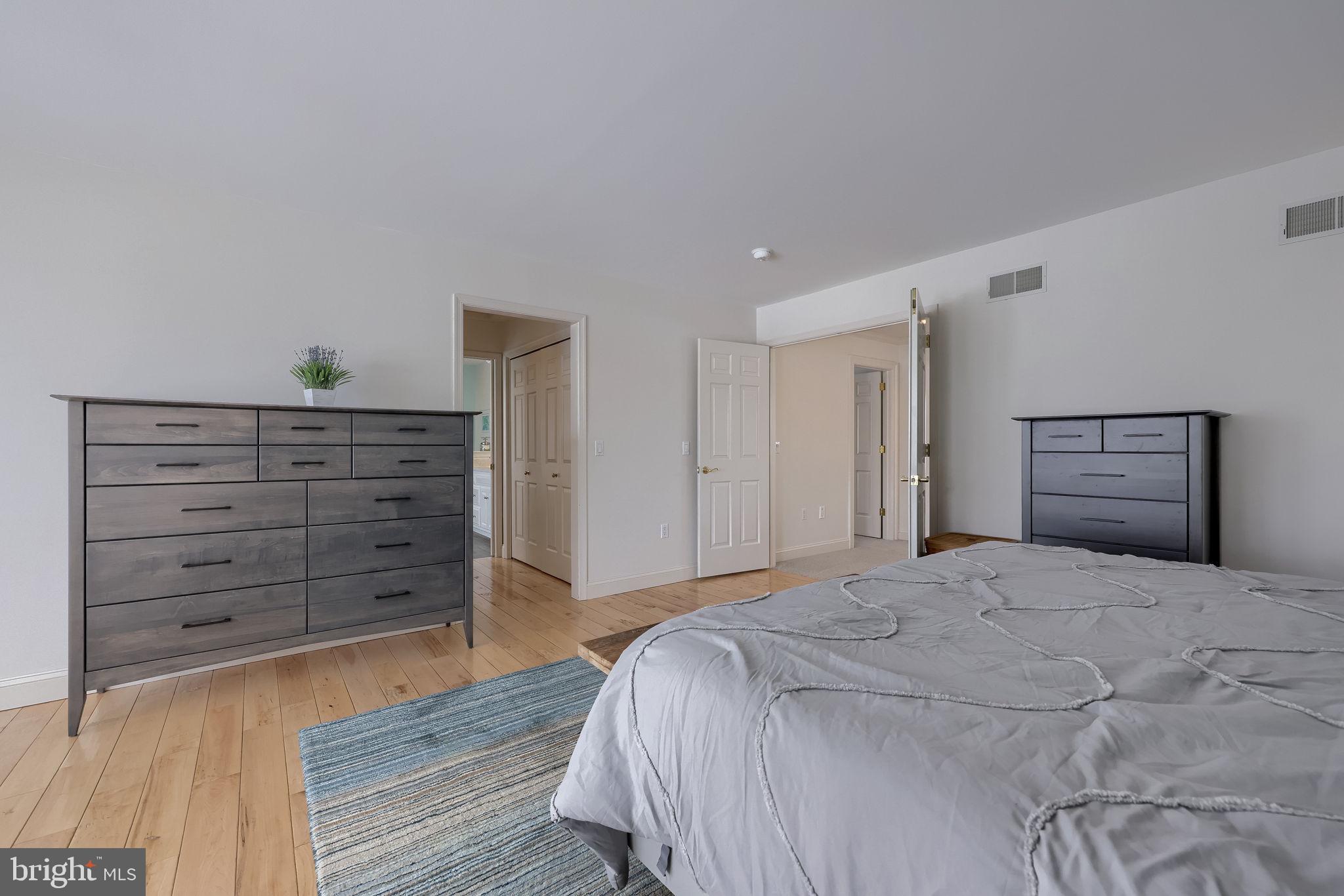 168 Olde Field Drive Lititz, PA 17543 - Photo 43 of 74 a spacious bedroom with a bed and a dresser