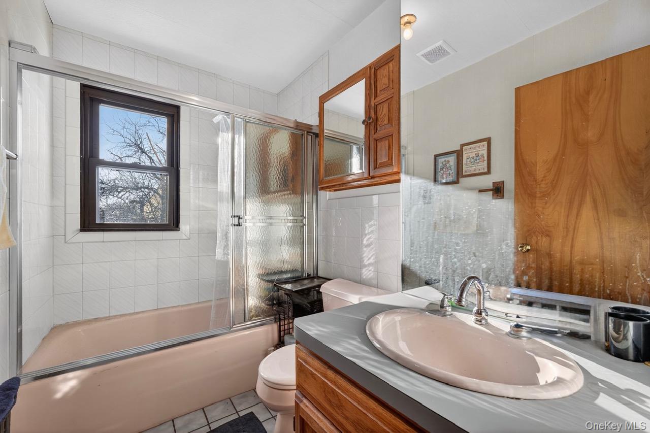 77-48 74th Street Queens, NY 11385 - Photo 11 of 14 Upstairs bathroom