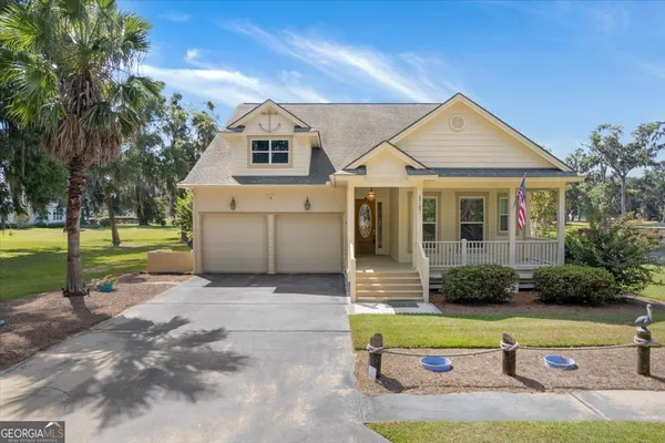 a front view of a house with garden