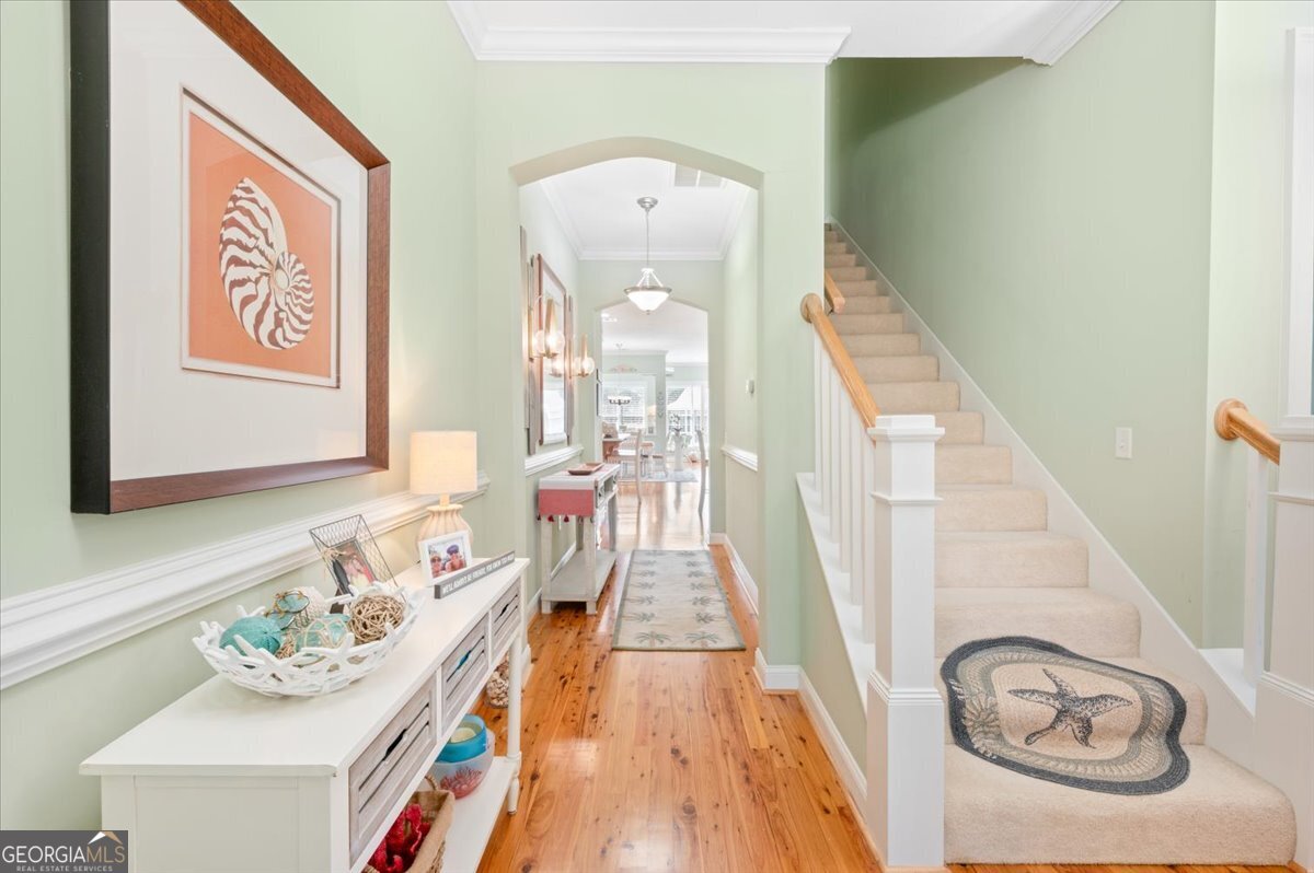 4787 Sunbury Road Midway, GA 31320 - Photo 12 of 72 a view of a hallway with furniture and wooden floor