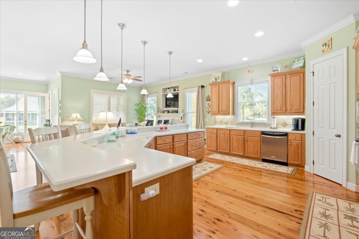 4787 Sunbury Road Midway, GA 31320 - Photo 15 of 72 a large kitchen with kitchen island a large island in it