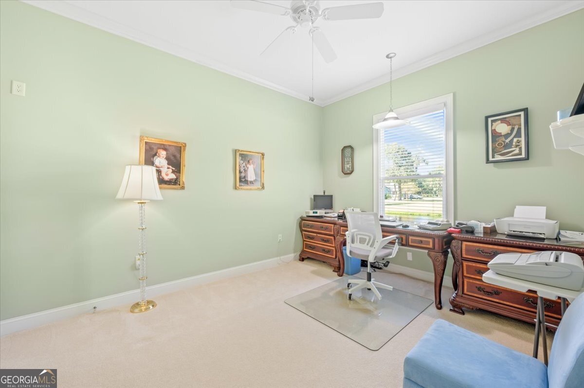 4787 Sunbury Road Midway, GA 31320 - Photo 41 of 72 a bedroom with furniture and a window