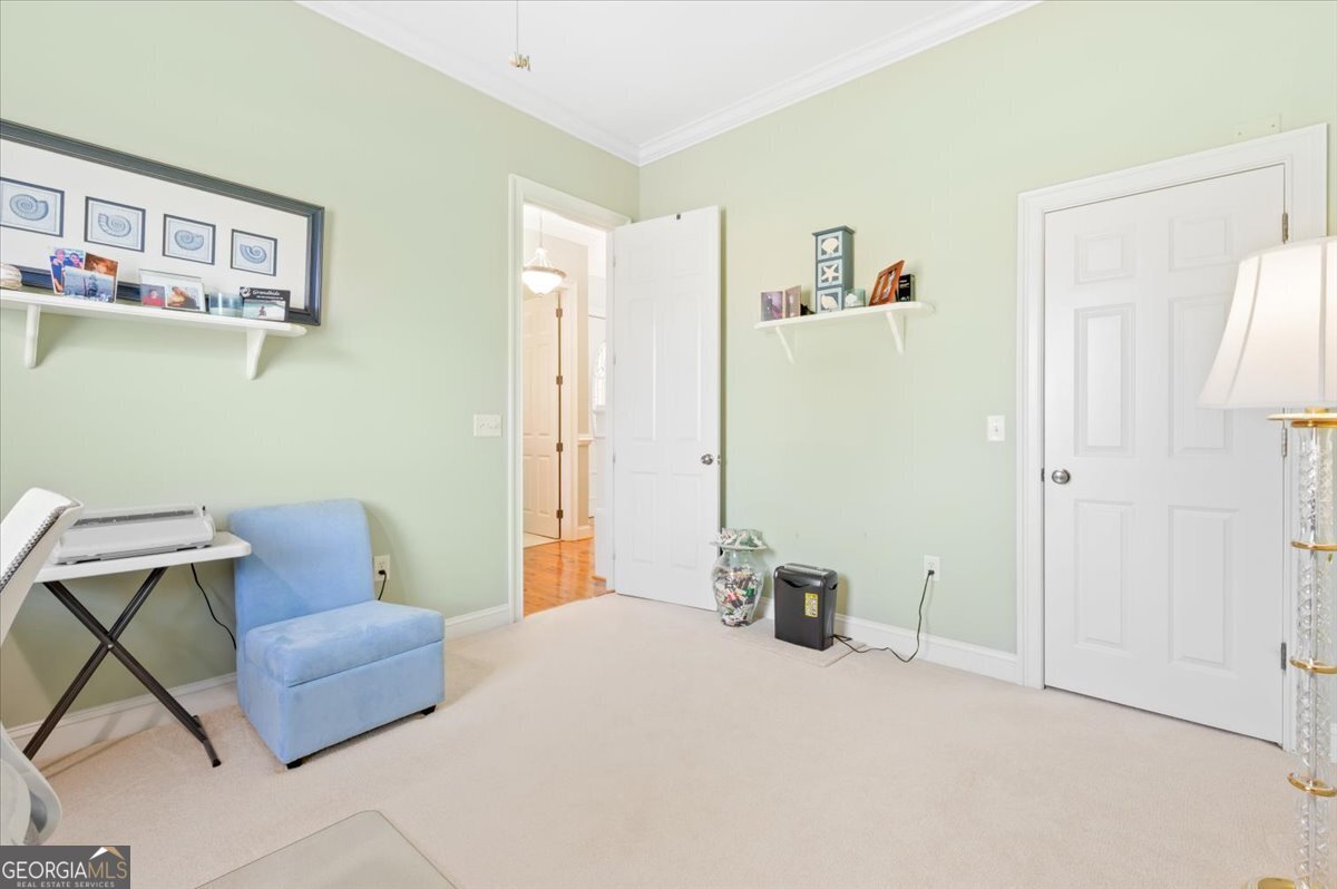 4787 Sunbury Road Midway, GA 31320 - Photo 43 of 72 a bedroom with a bed and chair