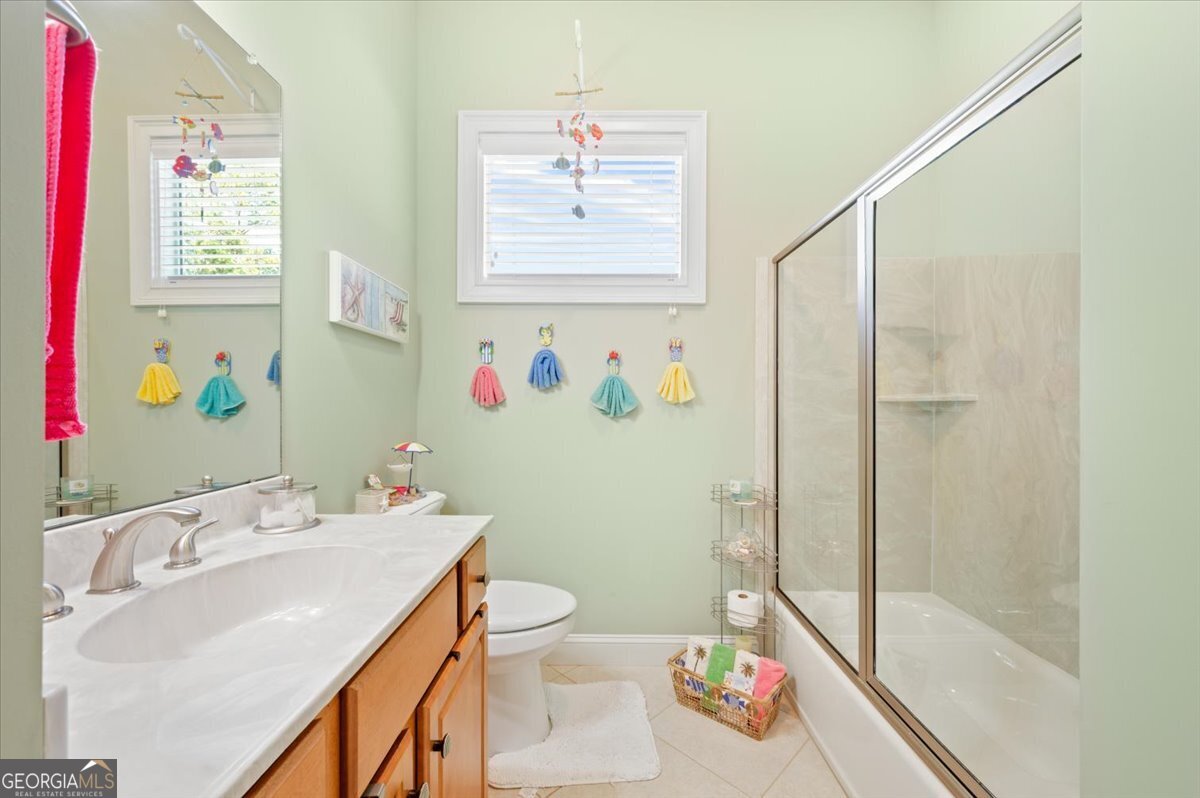 4787 Sunbury Road Midway, GA 31320 - Photo 47 of 72 a bathroom with a sink toilet and shower