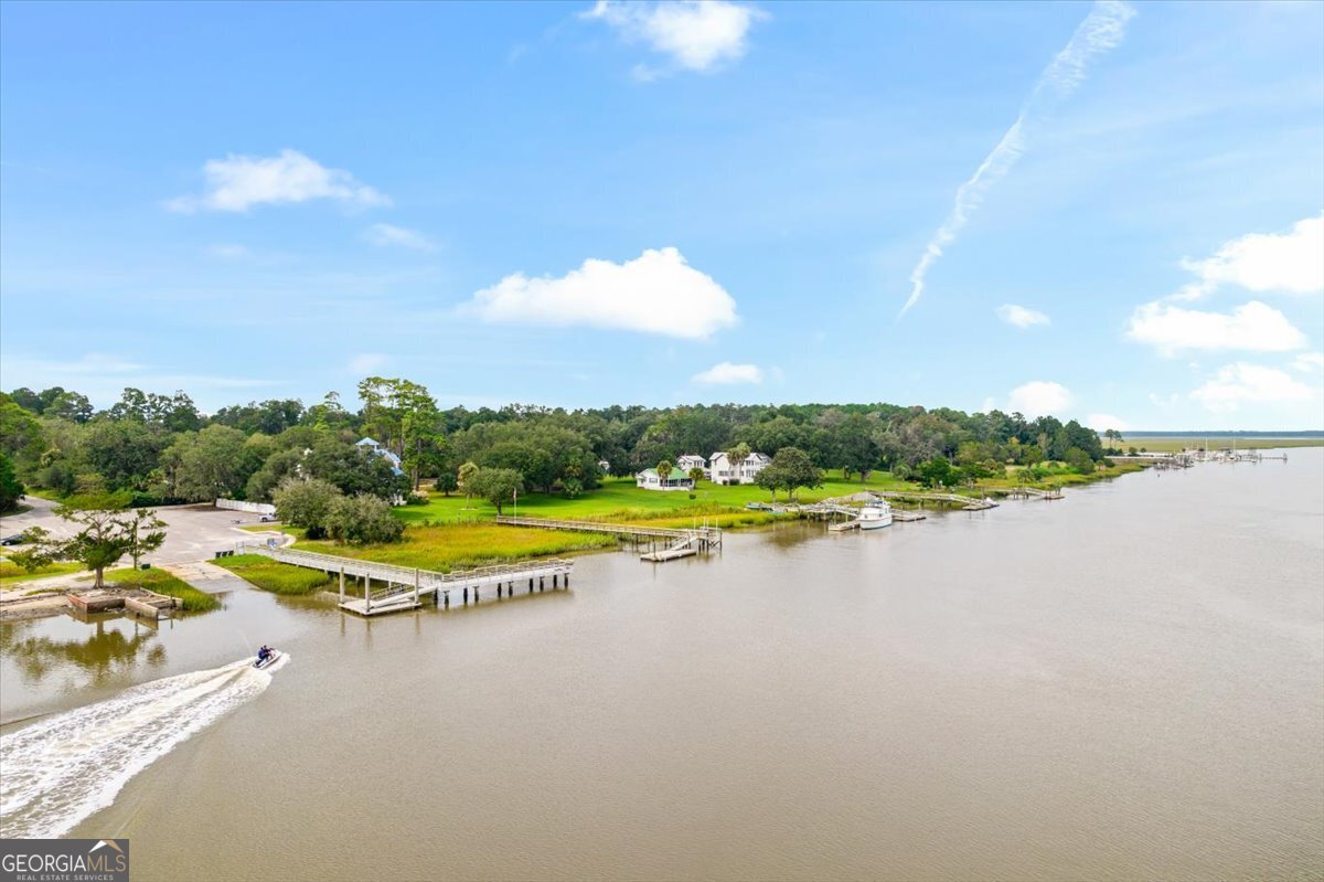 4787 Sunbury Road Midway, GA 31320 - Photo 56 of 72 a view of a swimming pool and lake view