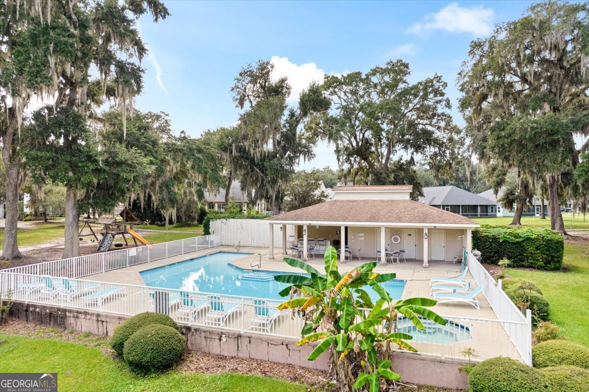 4787 Sunbury Road Midway, GA 31320 - Photo 61 of 72 a front view of house with yard and outdoor seating