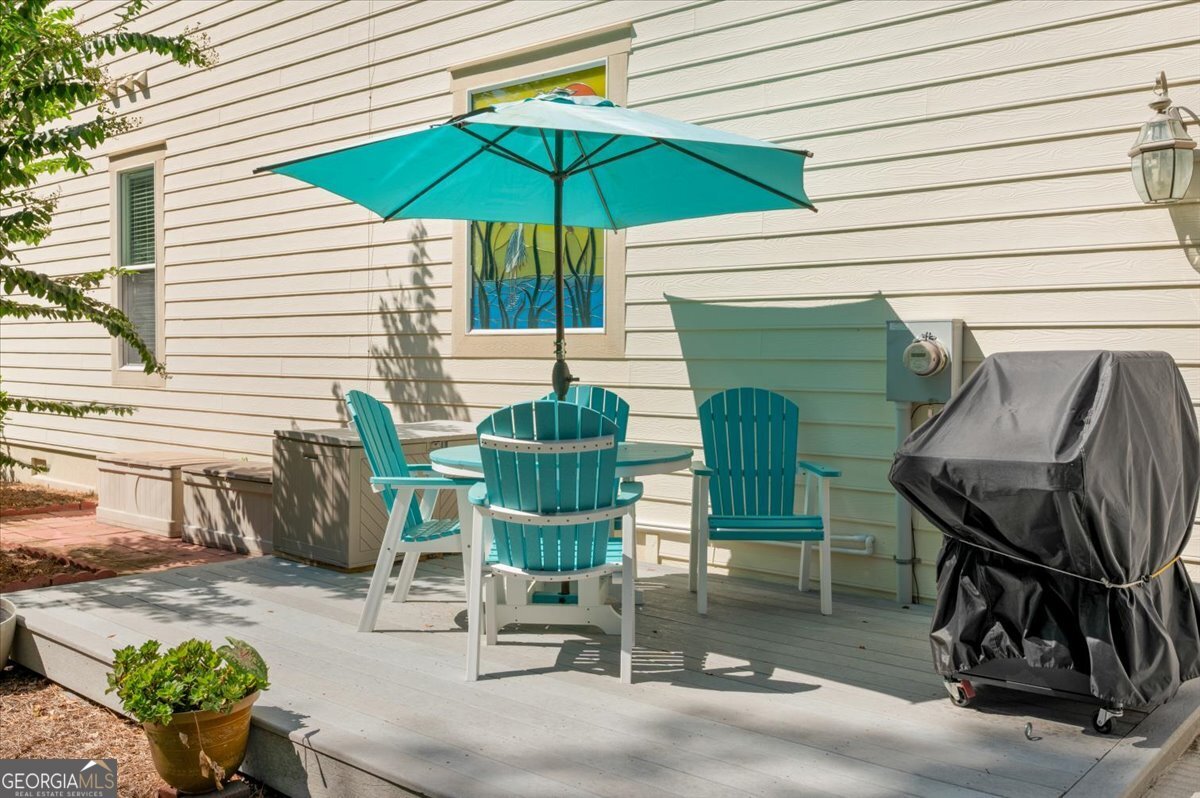 4787 Sunbury Road Midway, GA 31320 - Photo 64 of 72 a view of a chairs and table in the patio