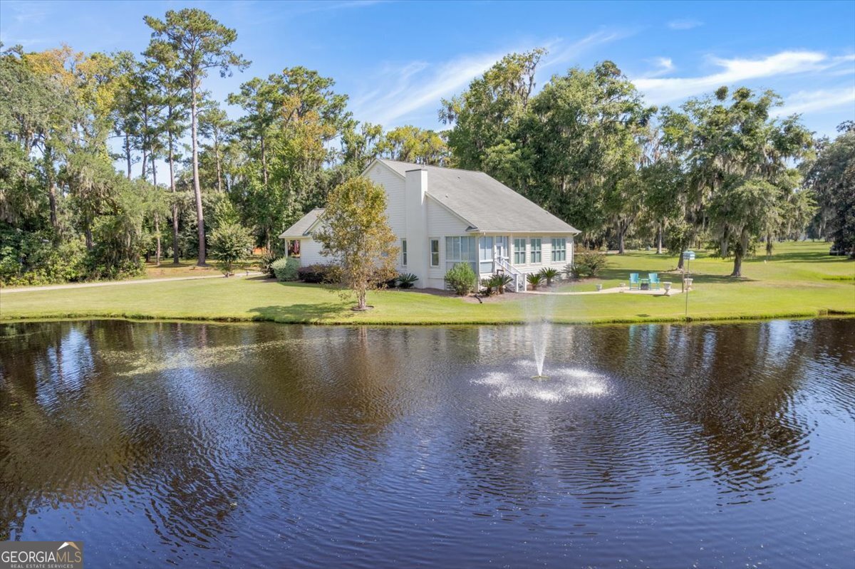 4787 Sunbury Road Midway, GA 31320 - Photo 7 of 72 a view of a lake with houses