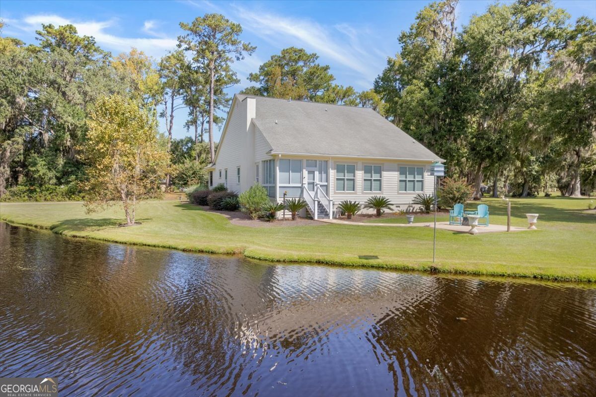 4787 Sunbury Road Midway, GA 31320 - Photo 8 of 72 a view of house with a yard and swimming pool