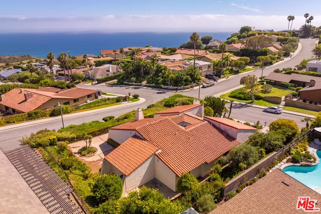 an aerial view of residential houses and outdoor space