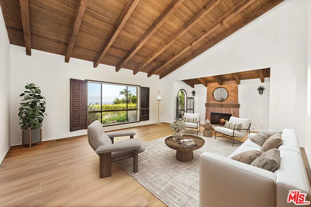 a view of room with wooden floor and windows