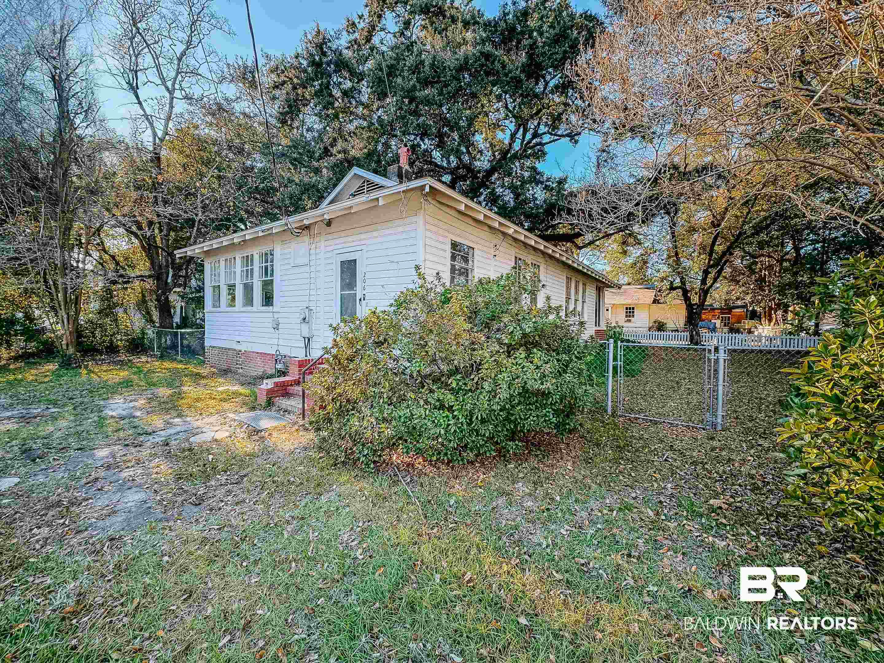 206 1st Street Mobile, AL 36611 - Photo 23 of 26 View of side of property featuring a gate